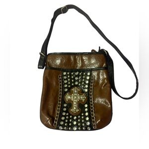 Brown and Black Crossbody Bag with Studded Cross Design.
